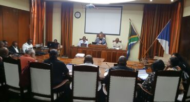 Image of Endumeni councillors seated around the council chamber during a meeting.