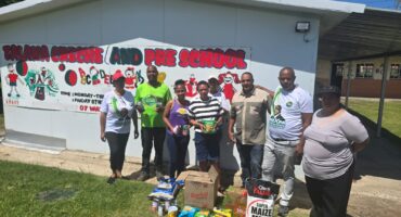 Image of people donating food stuff to a creche in Dundee.