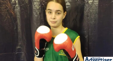 Zonica Booÿse, a young Kickboxer in her gear.