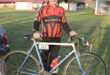 Image of a senior cyclist next to his bicycle in Dundee.
