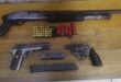 Image of three firearms and ammunition.