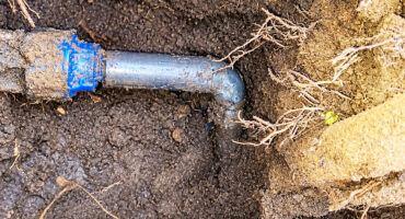Image of a water meter and pipe.