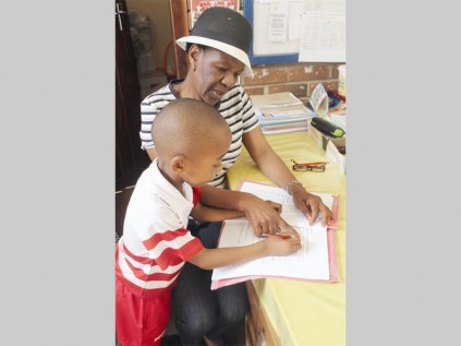 Maria Tema with one of her learners, Oreneile Mokgehle.