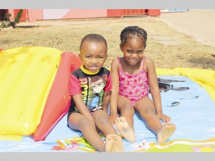 Lefa Motsane and Kgaugelo Segwapa cool down in the swimming pool.