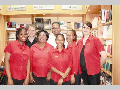 Cum Books celebrate its 22nd birthday with a talent show: In front are Maria Sefara, Anastacia Kgoale, Letago Tladi, Chriselda Andreas and Elzanne van Wyk. In the back are Johan Visagie (manager) and Hein April, a gospel musician from Johannesburg.