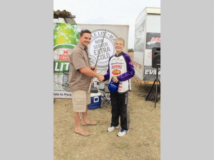 Frank Hislop congratulates Stephen Hall for winning the prize for the best young fisherman.