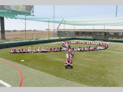 Northern Muslim School learners show create a pink ribbon in support of breast cancer.