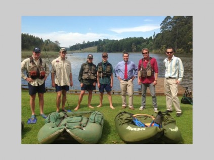Valiant Swart learns more about fly fishing from SLC's fishermen. With them are headmaster, Craig Carolan, and Rhoan Abbott, their fly-tying instructor.