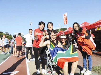 For Tata Madiba, for South Africa. Johan van der Merwe and his wife, Corinne, shortly after he finished his gruelling race on Saturday.