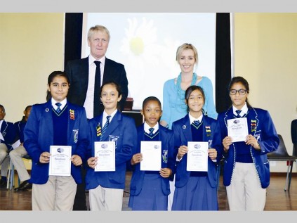 The Southern Cross Eisteddfod platinum - "renoster" winners (90% +) are Husnaa Dada, Ayesha Ayob, Mahlatse Tladi, Faaria Rhemtula (she was also awarded the overall winner) and Shaakira Hassim. At the back are Andrew Cook (Mitchell House, headmaster) and Nadia du Preez (Mitchell House, teacher).