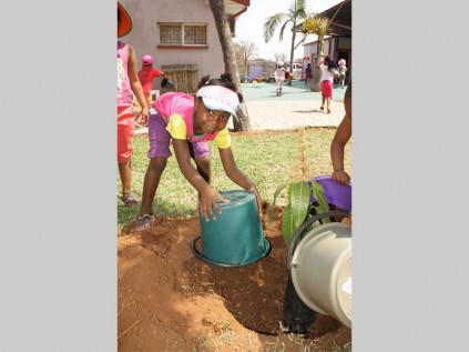 Boledi Mphahlele from Share Joy Pre-School learned how to plant a tree.