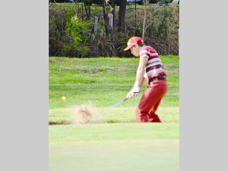 Eduan Kotze plays on the bunker during the Mike's Chicken Monthly Medal golf challenge.