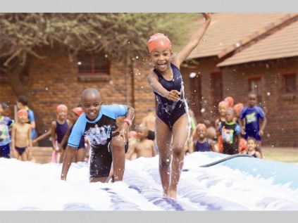 Zakaria Mkhabele and Kwena Mashilo tread carefully on the slippery foam slide.