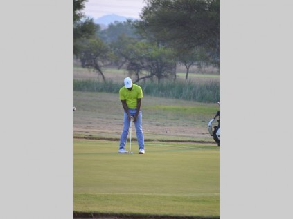 Former Polokwane mayor Freddy Greaver aim concentrates on sinking the ball during the Review golf challenge payed at the Polokwane Golf Club on Wednesday.