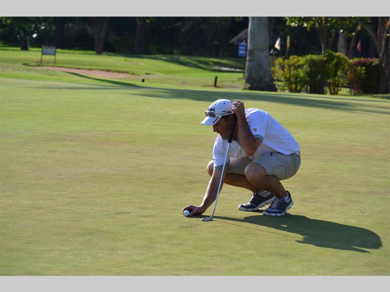 Nico Myburgh marks his position on the green during the Polokwane Open. Myburgh came third in the A-division.