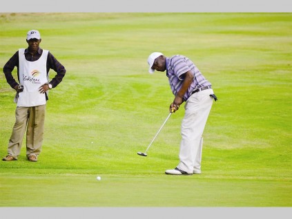 Lucas Sono concentrates on his putt at Leda's golf day at the Polokwane golf club last Thursday.