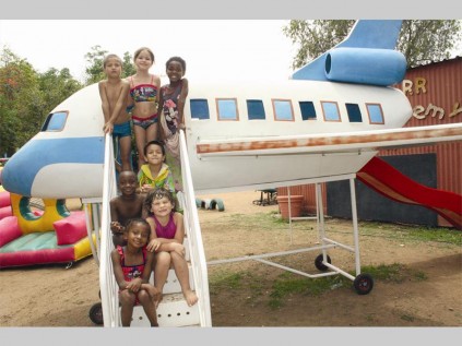 Gr. R and RR Academy learners play on an aeroplane at the school's year-end function. From the bottom are Shalom Moila, Kim Venter and Kgotso Mphalele. At the back are Justin Rossouw, Juan-Pierre Uys, Demi Steyn and Risima Baloyi.