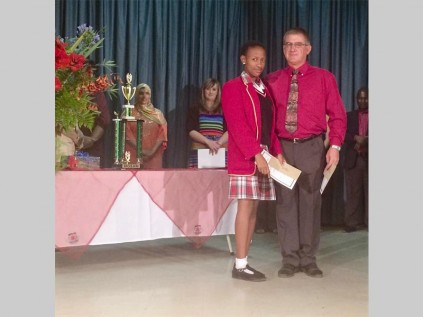 Riaan Foord (teacher) with Shoki Marymudi who received a certificate and prize as the top geography learner.