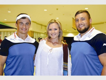 Vodacom Bulls players, Deon Stegmann and Dean Greyling congratulate competition winner, Wilhrisca Ehliers at Savannah Mall. She won two tickets to watch their warm-up game on Saturday.