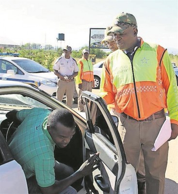 CllrThabisoMontanein inspects one of the vehicles during the Easter road campaign. Photo Supplied