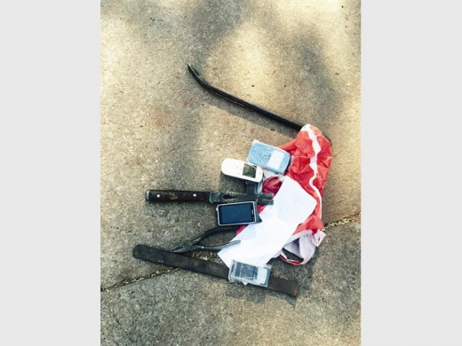 Tools and cell phones that were found inside a red sedan. Photos: Supplied