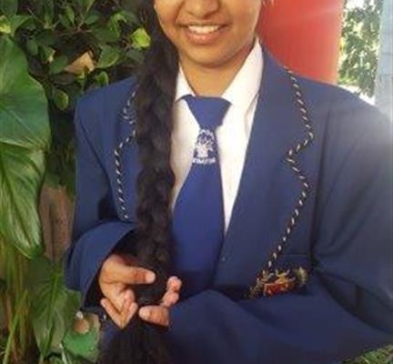 Sona Thomas with her long hair just before cutting it.