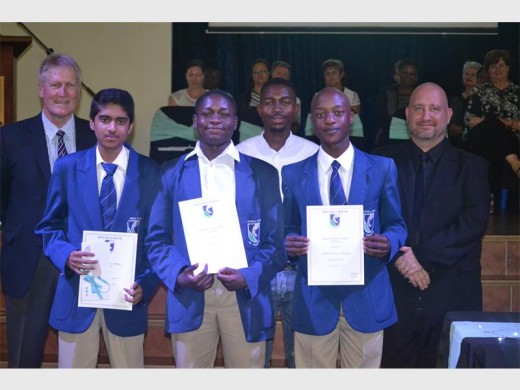 The Gr 10 top academic achievers are Rithik Samuel, Dauda Sheni and Michael Muchopa. At the back are Andrew Cook (headmaster), Green Lebelo, and Claude Goeminne (college HOD).
