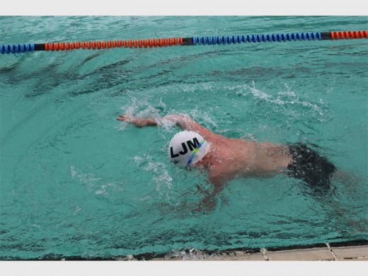 Nathan Struwig shows true grit in the boys u/10 freestyle. Nathan was the only disabled swimmer on the day and went on to win the multi-disability award.