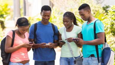modern african college student using their cell phones