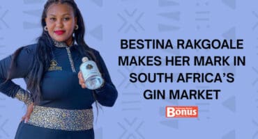 Bestina Rakgoale holds a bottle of her gin.