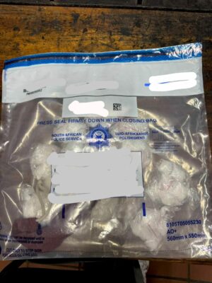 Photo of a SAPS evidence bag containing crystal meth.