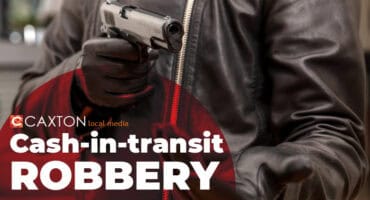 A close-up graphic for a news report about a cash-in-transit robbery, showing a person wearing black leather gloves and a leather jacket holding a black semi-automatic handgun pointed forward, with the headline "Cash-in-transit ROBBERY."