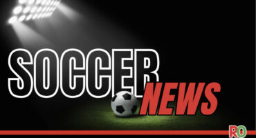 The words "Soccer News" with a soccer ball and stadium lights in the background.