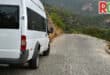 A minibus parked on the side of the road.