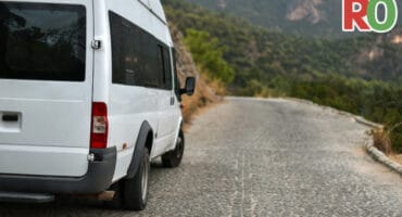 A minibus parked on the side of the road.