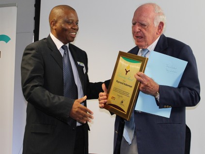 Businessman Herman Mashaba presents the seventh Luminary Award to Raymond Ackerman on behalf of the Free Market Foundation in Bryanston on 18 August.