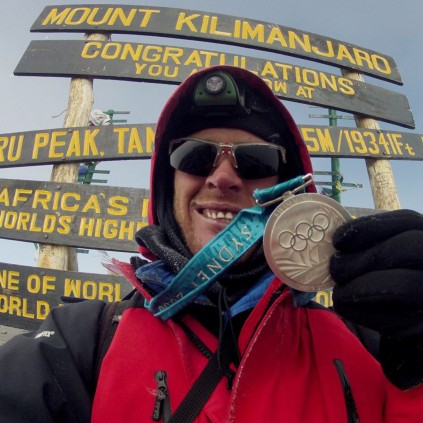 Terence Parkin shows off his medal for reaching Uhuru Peak on Mount Kilimanjaro.