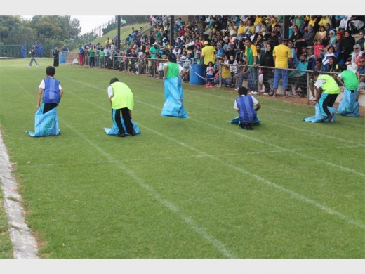Pupils enjoy flat races and novelty races at the Vorentoe High School sports ground.