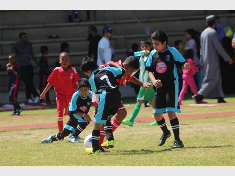 Players chase the ball.