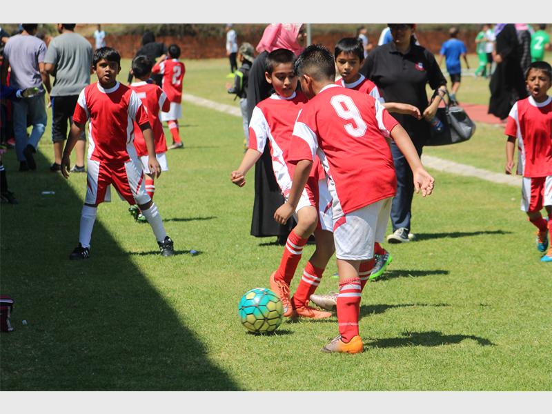 Players practise before their match.