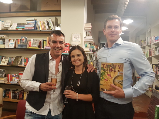 Jason Whitehead, Samantha Soll and Chris Human enjoy champagne over conversations about the book.
