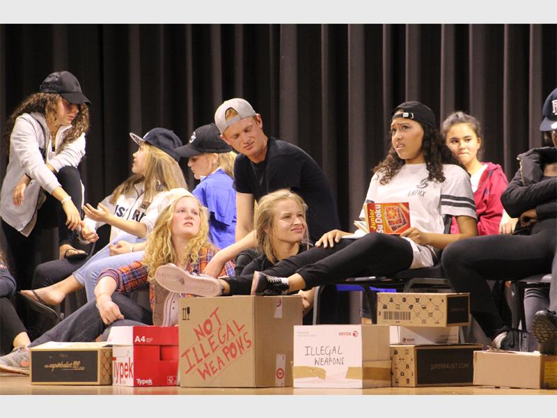 The cast of Insert title here on the stage.