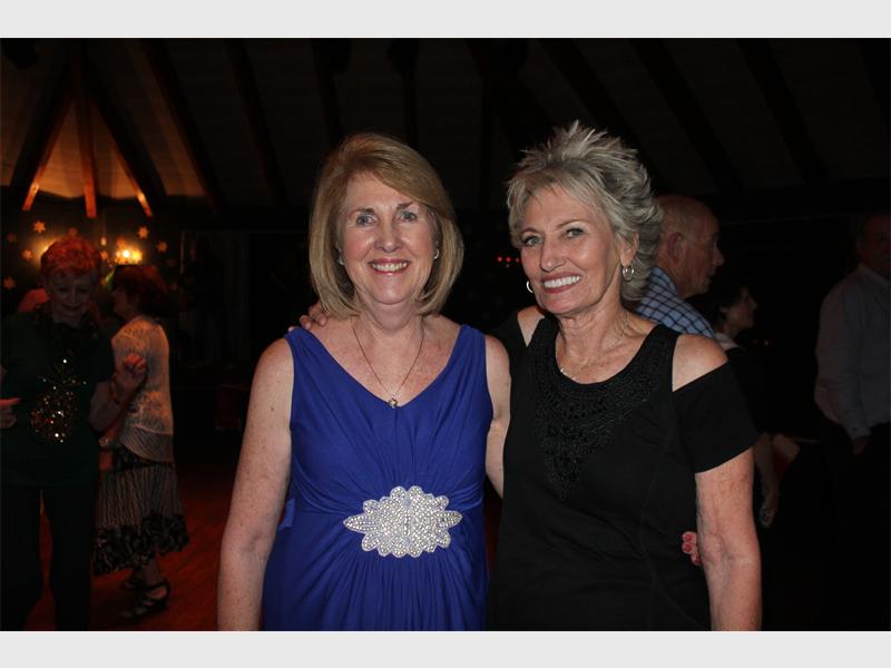 Chairperson of Our Club, Sandy Green shares a friendly moment with group member Una Gilchrist.