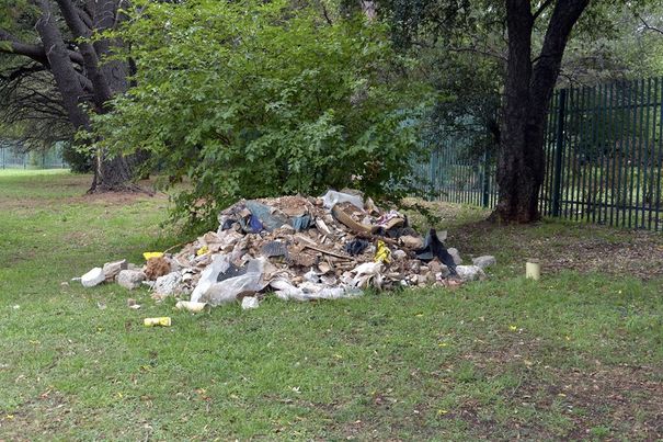 Unsightly rubble next to the fence at the Emmarentia Botanical Gardens. Photo: Supplied.