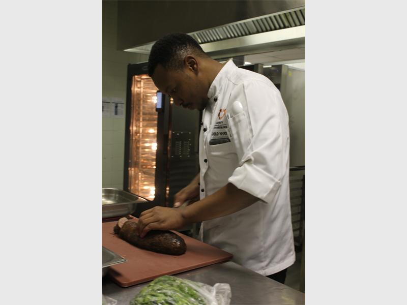 Executive sous chef, Tholo Nyatlo helps plate the beef fillet.