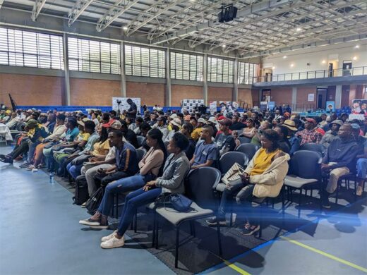 Presentations are made to a packed crowd