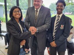 Qitarah Pillay with the principal Willie de Wet and Arabile Maphiri who is the junior mayor.