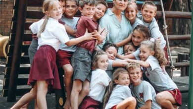 Ronell Gouws is embraced by her Grade 3 class learners.
