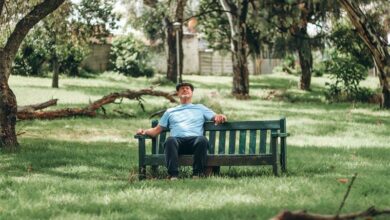 Clive Malherbe sits on bench in Greymont Park.