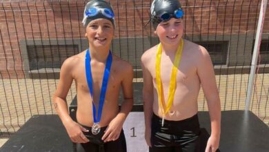 Jax Friedman and Slade Reichman-Israelsohn show their medals